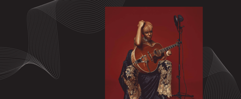 Music artiist SAJE with her guitar