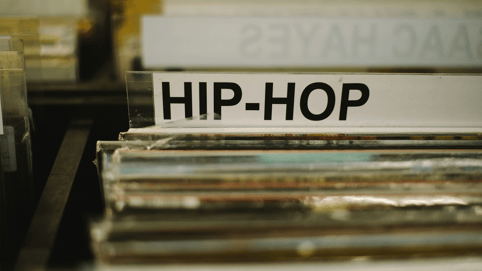 The hip hop section of a record store features stacks of the best retro hip hop music records