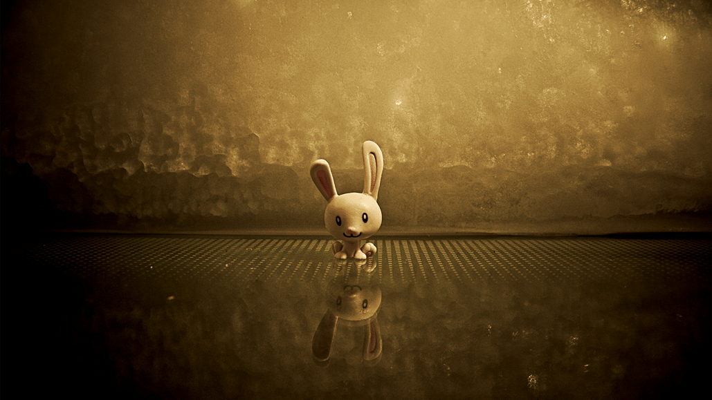 An animated rabbit stands against a gold background, about to be brought to life using royalty free music for animation.