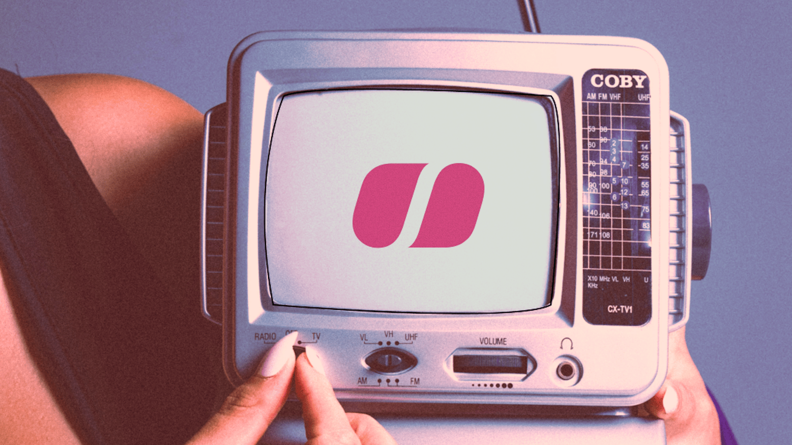 woman holding a retro looking TV with the soundstripe logo in it
