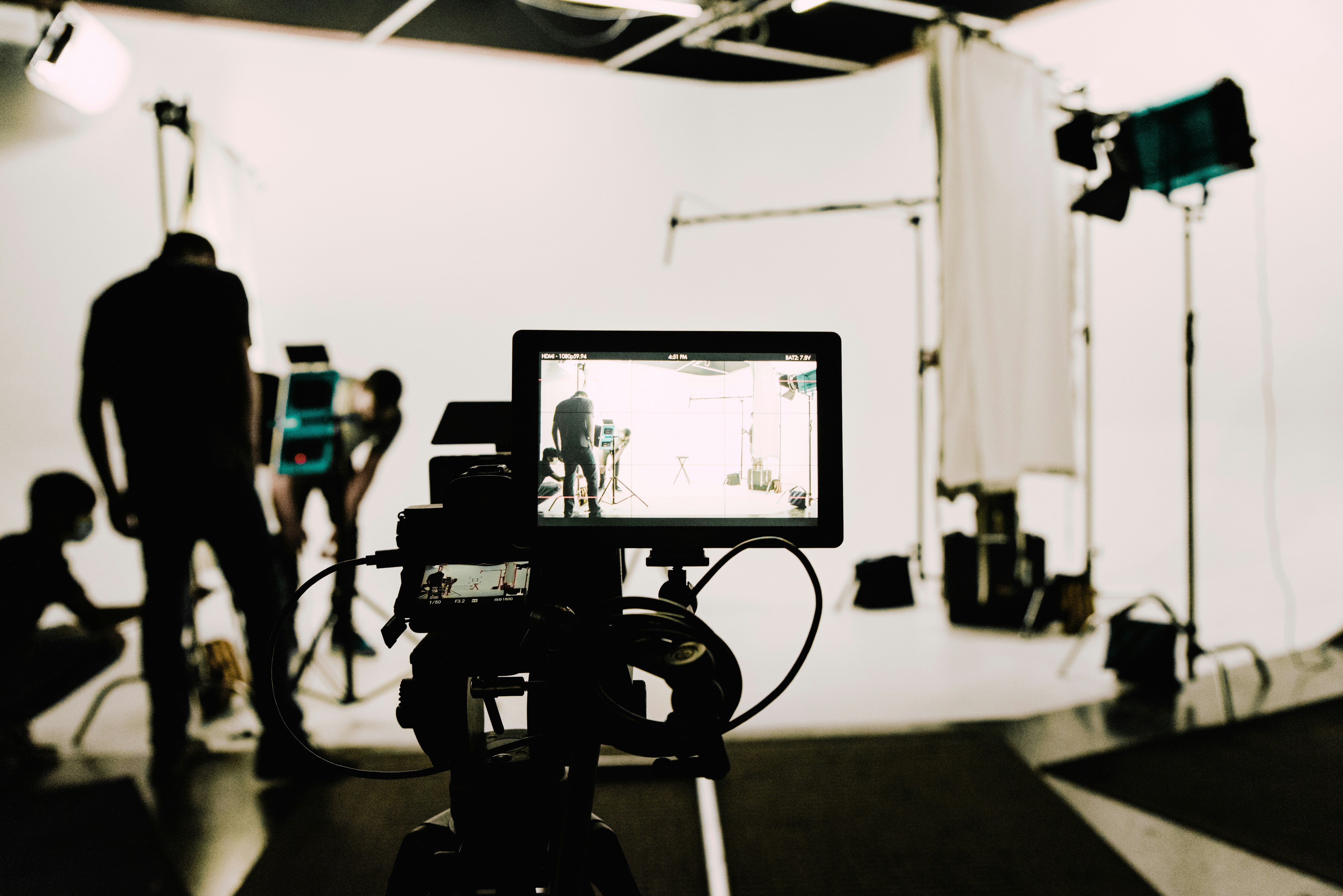 Camera and crew on a studio production set