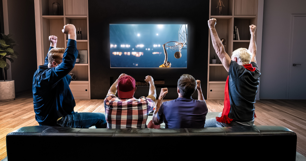 Group-of-men-watching-basketball-game-on-television