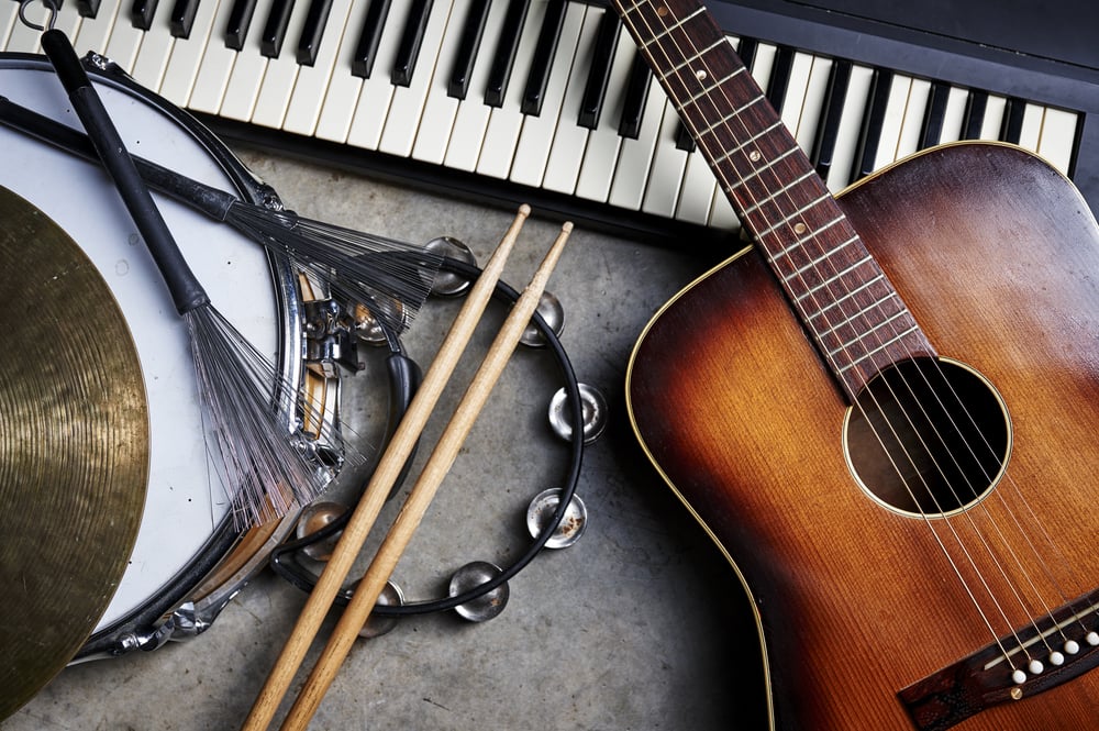 Variety of musical instruments, including acoustic guitar, keyboard, and drum.