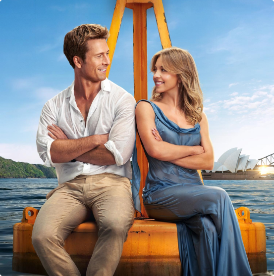 A man and woman sit on a buoy in the film 'Anyone but You', which used Soundstripe music sync licensing in its soundtrack.